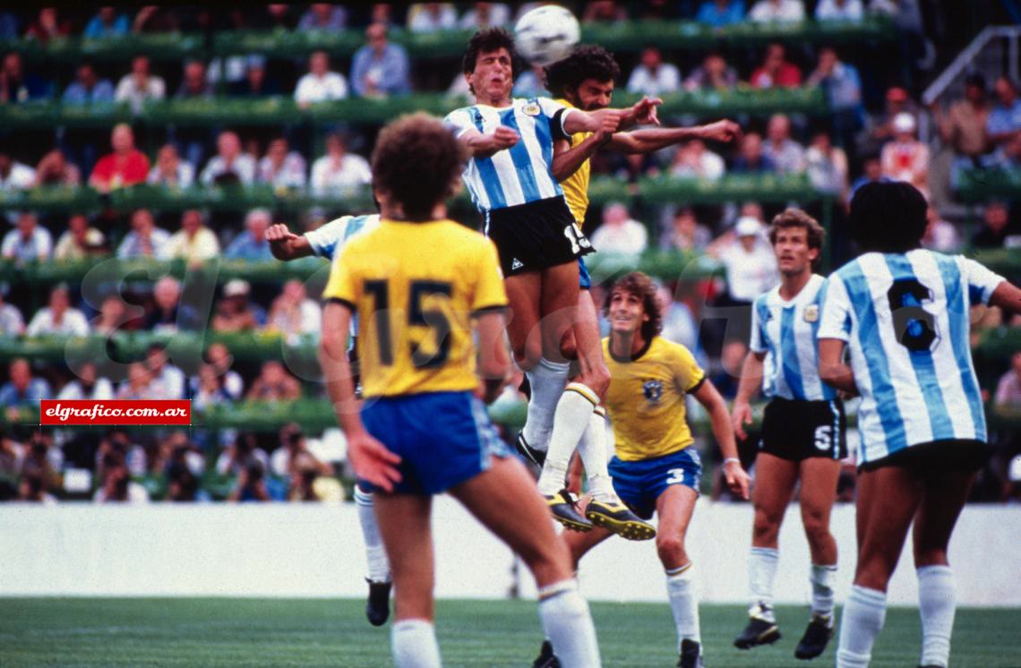 Daniel Passarella jumping to head the ball against Brazil at the 1982 World Cup