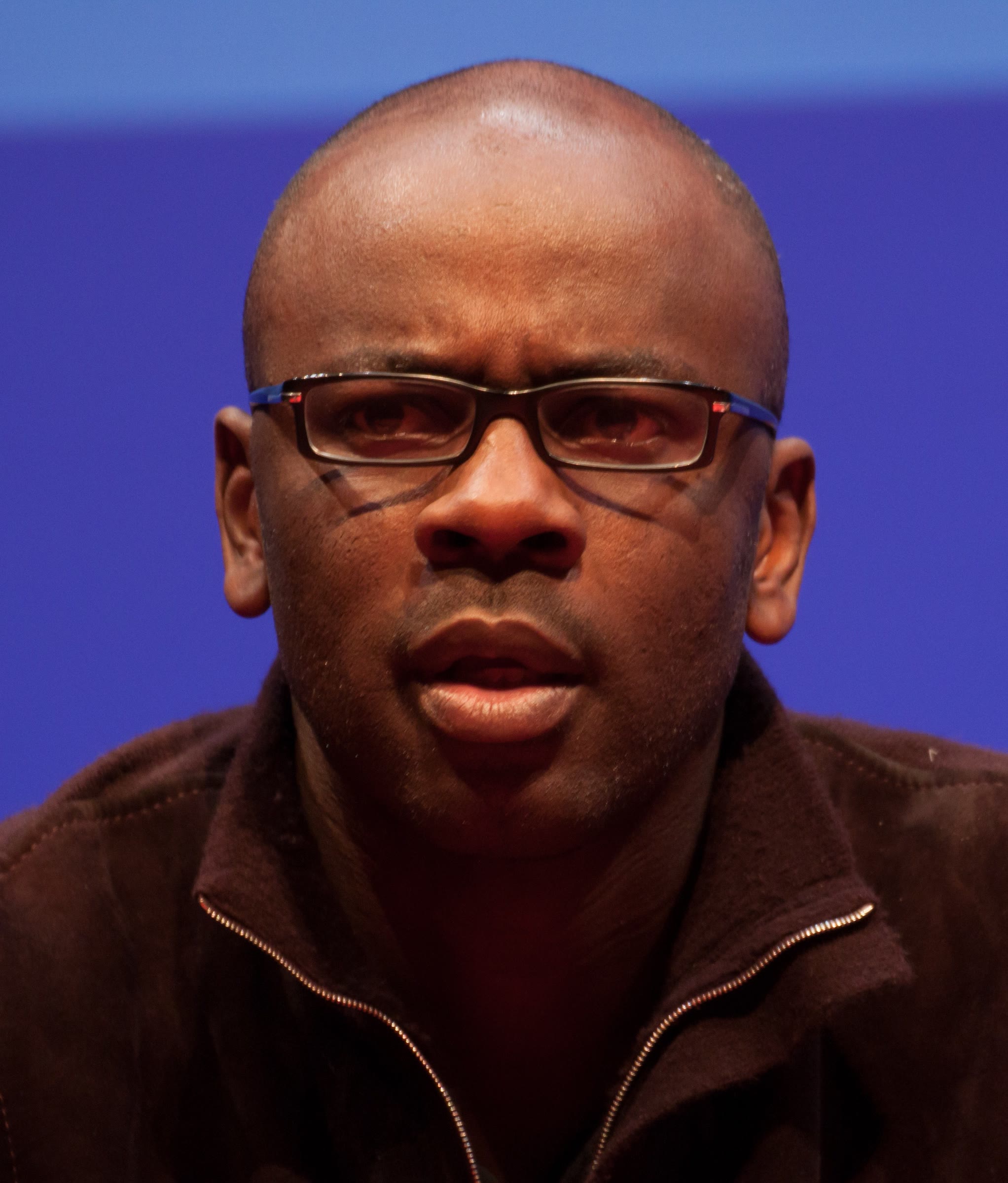 Portrait of Lilian Thuram speaking at an event in 2013
