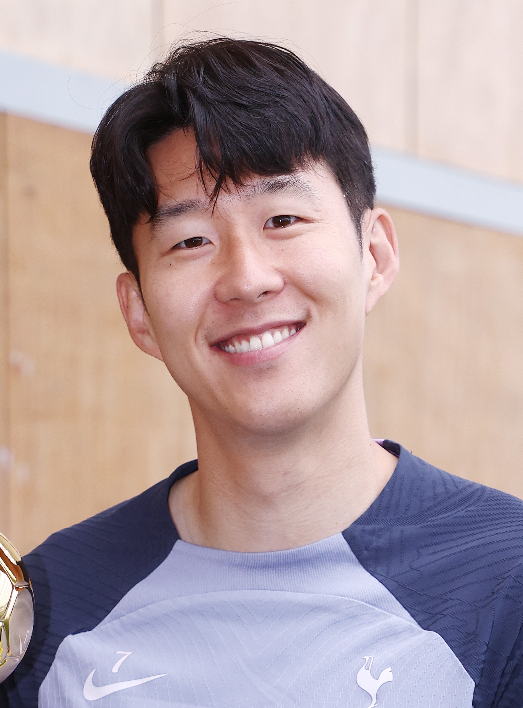 Son Heung-min smiling in Tottenham training kit.