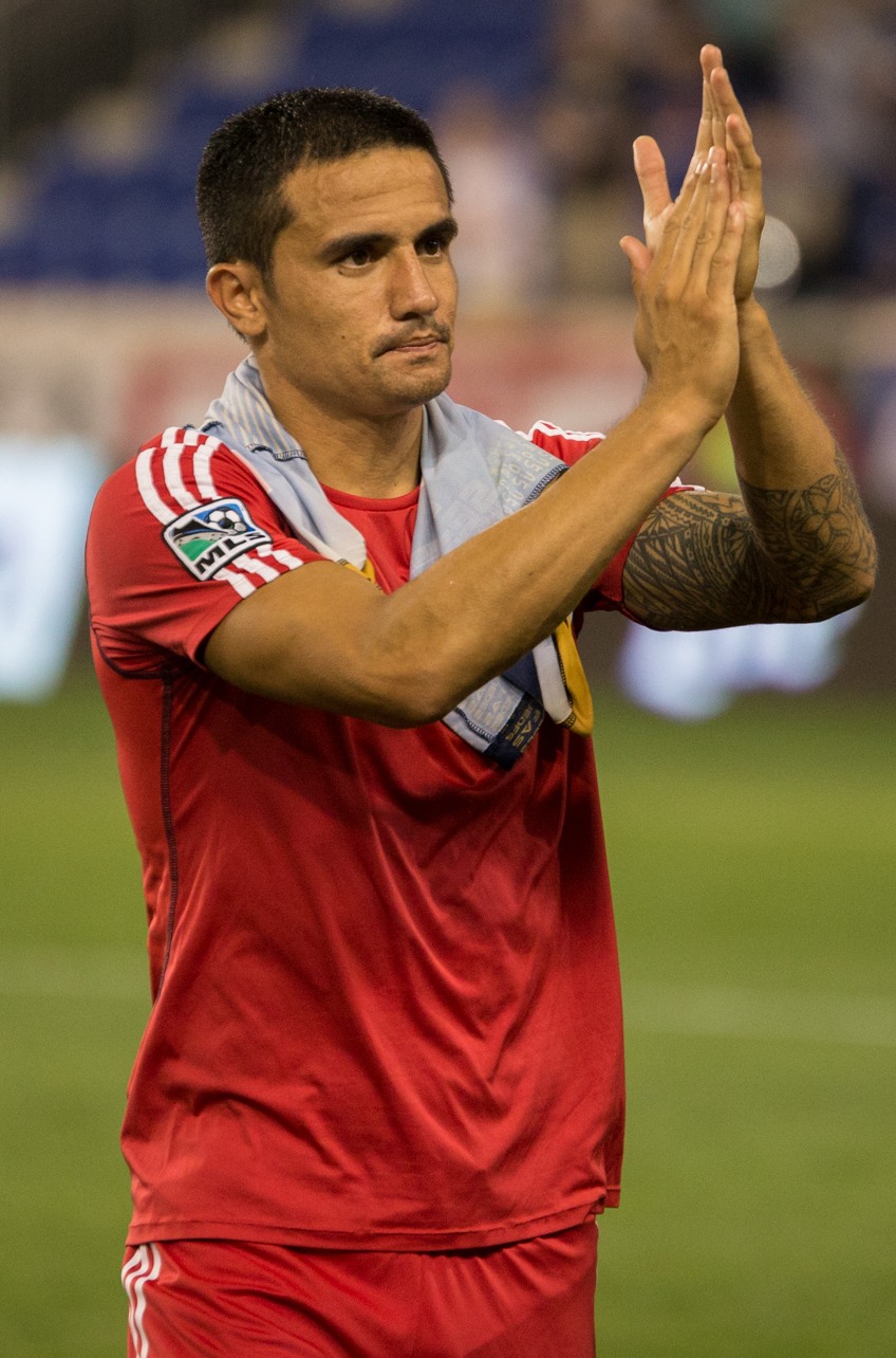 Tim Cahill applauding in New York Red Bulls kit after a 2014 match.