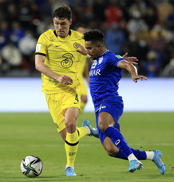 Salem Al-Dawsari challenging Andreas Christensen for the ball in February 2022.