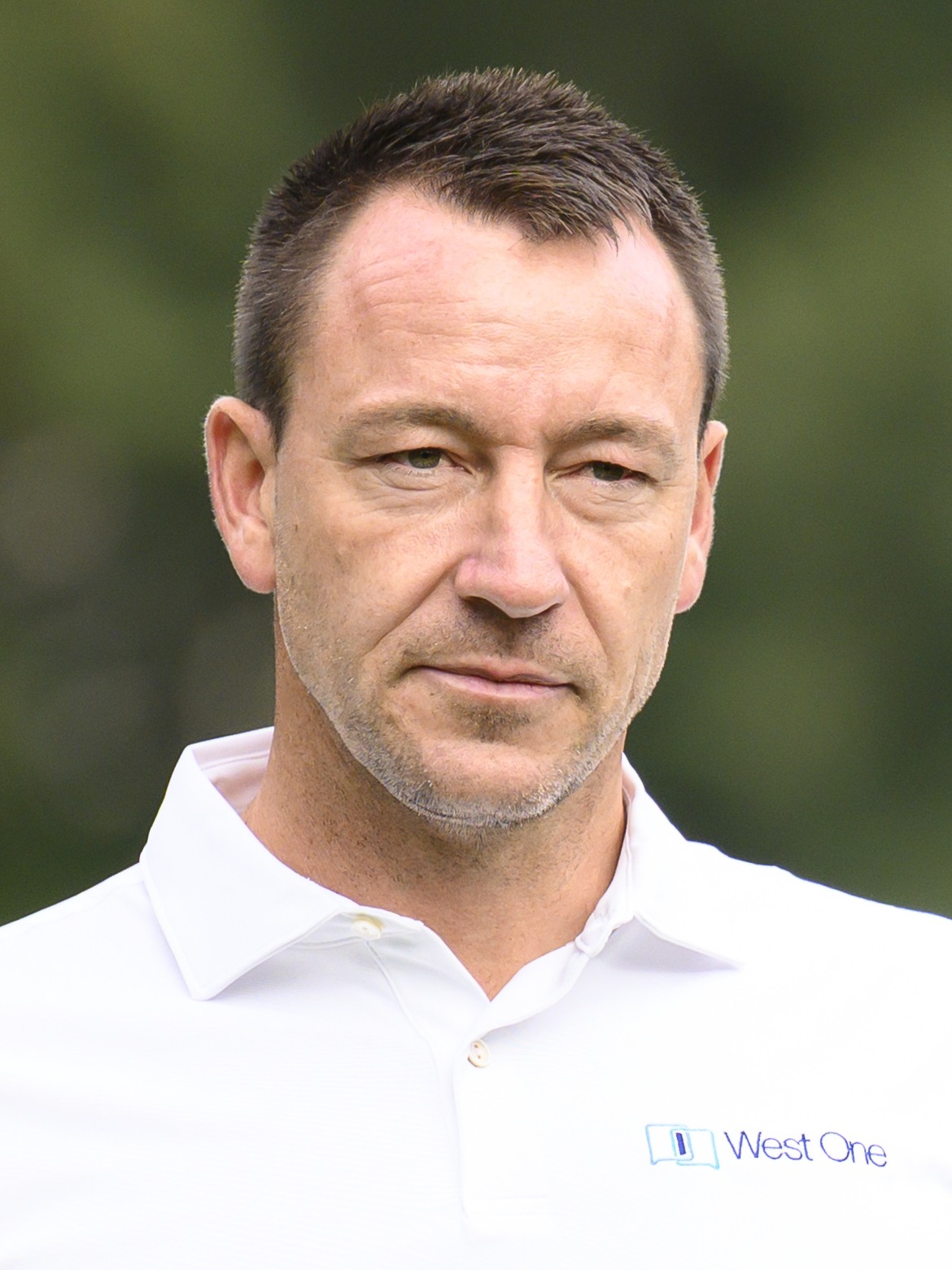 John Terry walking from the Tee at Wentworth Golf Club during pro-am in 2023.
