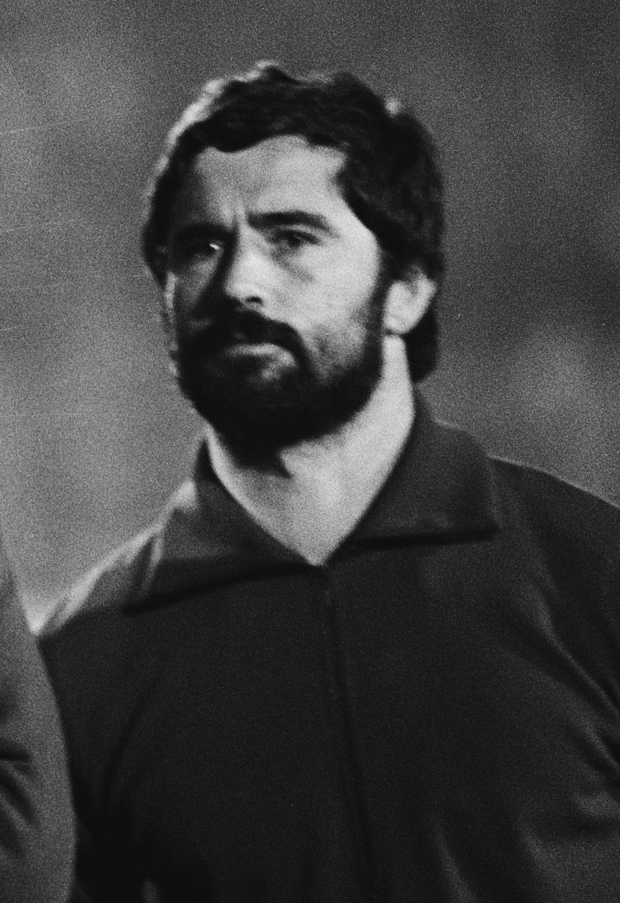 Black-and-white portrait of Gerd Müller with a beard and dark collared shirt in 1978.