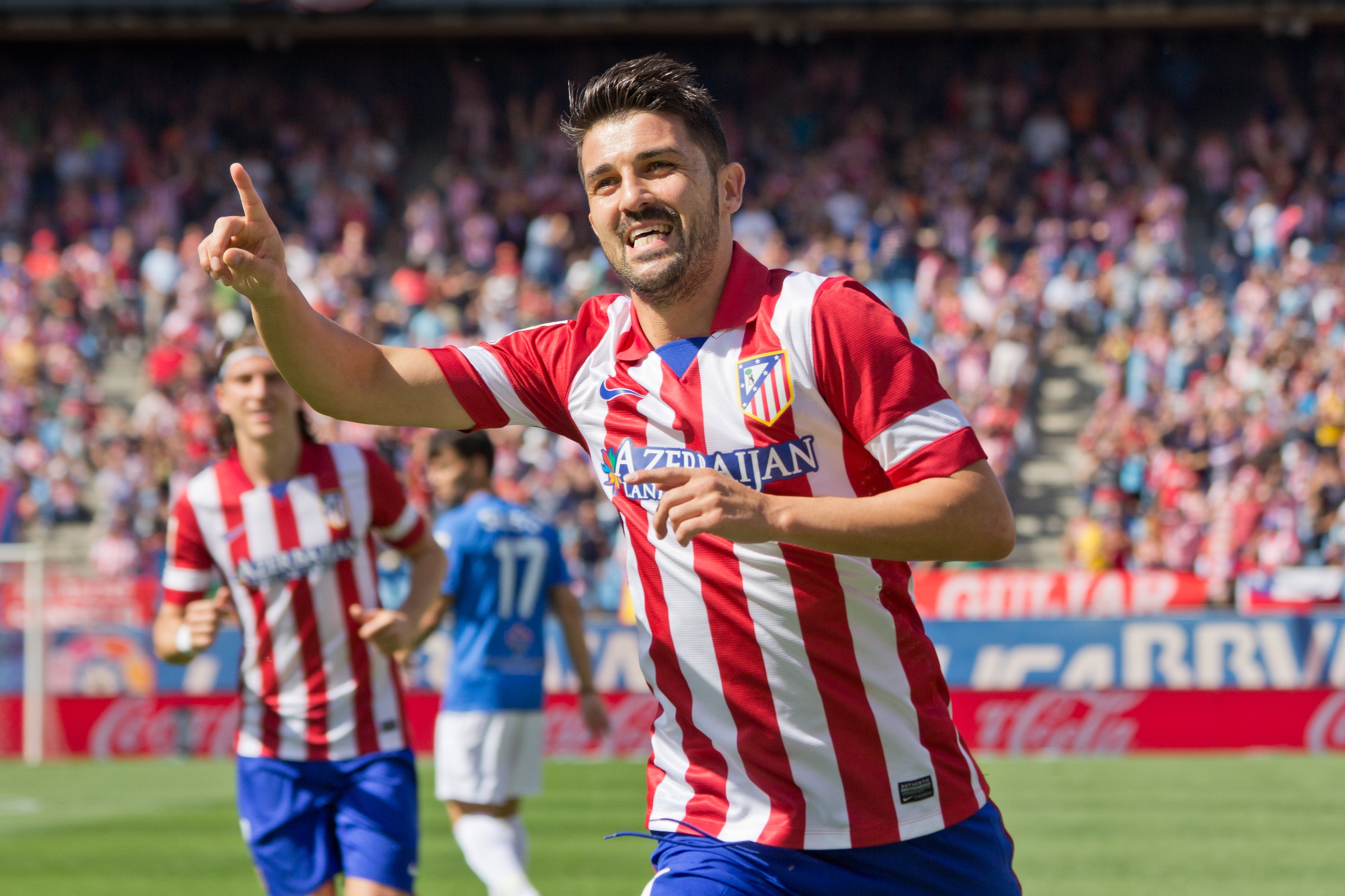 Spanish football player David Villa celebrating after scoring a goal for Atlético de Madrid.